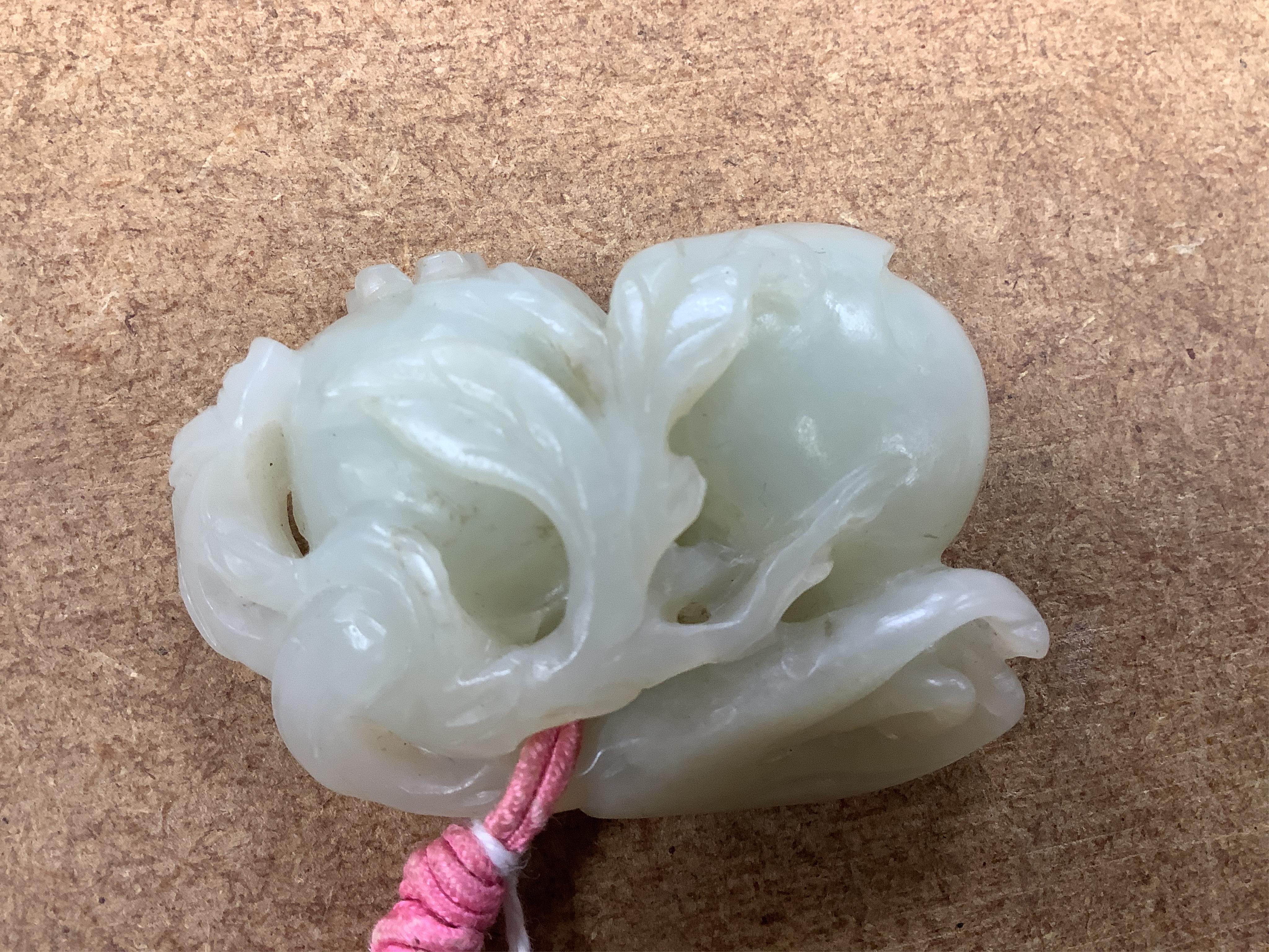 A 19th century jade carving of fruit, 5.5cm wide. Condition - fair, a small piece missing